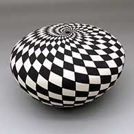A black-on-white seed pot with a spiraling checkerboard geometric design
 by Sandra Victorino of Acoma