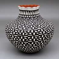 A polychrome jar with a pie crust rim and decorated with a black-on-white geometric design
 by Sandra Victorino of Acoma