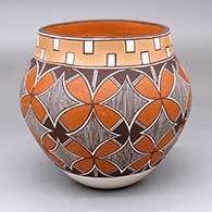 A polychrome jar decorated with a pumpkin seed snowflake and geometric design
 by Diane Lewis of Acoma