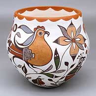 A polychrome jar decorated with a bird, flower, fish and geometric design
 by Diane Lewis of Acoma