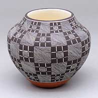 A polychrome jar decorated with a fine line and stylized checkerboard and geometric design
 by Rebecca Lucario of Acoma