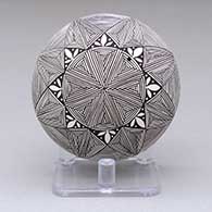 A black-on-white seed pot decorated with a fine line and geometric design
 by Alisha Sanchez of Acoma