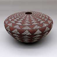 A polychrome seed pot decorated with bands of fine line and geometric design
 by Sandra Victorino of Acoma