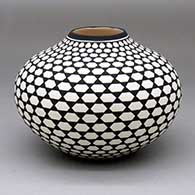 A black-on-white jar with a raised opening and a geometric design
 by Paula Estevan of Acoma