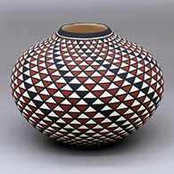 A polychrome jar with a raised opening and a spiral mesa geometric design
 by Paula Estevan of Acoma
