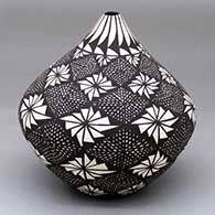 A black-on-white tear-drop jar decorated with a fine line and geometric design
 by Sandra Victorino of Acoma