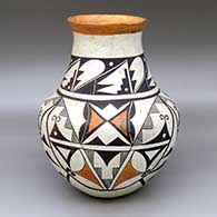 A polychrome jar with a recurved neck and decorated with a three-panel geometric design
 by Mary Histia of Acoma