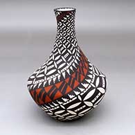 A polychrome tall necked vase decorated with a pumpkin seed snowflake, kiva step and geometric design
 by Sandra Victorino of Acoma