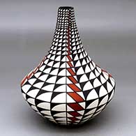 A polychrome vase decorated with a four-panel geometric design
 by Sandra Victorino of Acoma