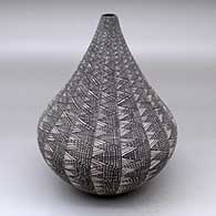 A black-on-white tear drop jar decorated with a fine line geometric design
 by Sandra Victorino of Acoma