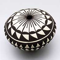 A black-on-white seed pot decorated with a geometric design
 by Cletus Victorino of Acoma