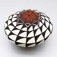 A polychrome seed pot decorated with a geometric design
 by Cletus Victorino of Acoma