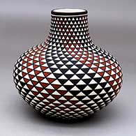 A polychrome jar decorated with a spiral mesa geometric design
 by Paula Estevan of Acoma