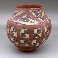 A polychrome jar decorated with a four-panel geometric design above the shoulder and a twelve-panel geometric design below the shoulder
 by Unknown of Laguna