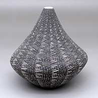 A black-on-white tear drop jar decorated with a fine line geometric design
 by Sandra Victorino of Acoma