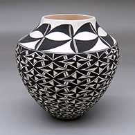 A black-on-white jar decorated with a geometric design
 by Cletus Victorino of Acoma