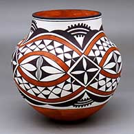 A polychrome jar decorated with a four-panel rainbow, cloud formation and geometric design
 by Kylie Patricio of Acoma