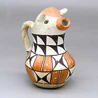 A polychrome cream pitcher with a cow head spout, twisted handle and geometric design around the body and neck
 by Unknown of Acoma