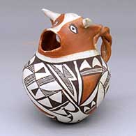 A polychrome cream pitcher with a cow head spout, twisted handle and geometric design
 by Unknown of Acoma