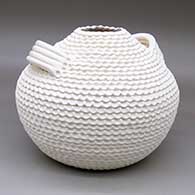 A corrugated white jar with handles
 by Jackie Shutiva of Acoma