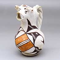 A polychrome cream pitcher with a cow head spout, twisted handle and geometric design
 by Unknown of Acoma