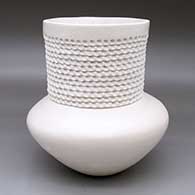 A low-shoulder white jar with a tall, corrugated neck
 by Jackie Shutiva of Acoma