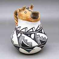 A polychrome cream pitcher with a cow head spout, twisted handle and black-on-white kiva step, fine line and geometric design
 by Unknown of Acoma