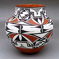 A polychrome jar decorated with a four-panel geometric design
 by Felisha Patricio of Acoma