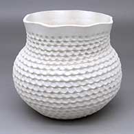 A corrugated white jar with a short neck and fluted rim
 by Jackie Shutiva of Acoma