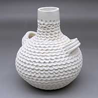 A tall-neck corrugated white jar with handles
 by Jackie Shutiva of Acoma