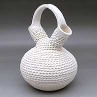 A corrugated white wedding vase
 by Jackie Shutiva of Acoma