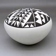 A large black-on-white seed pot decorated on top with a two-panel geometric design
 by Jackie Shutiva of Acoma