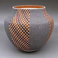 A polychrome jar decorated with an eight-panel geometric design
 by Frederica Antonio of Acoma