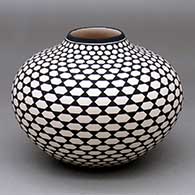 A black-on-white jar with a geometric design
 by Paula Estevan of Acoma