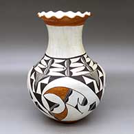 A polychrome vase with a pie crust rim and decorated with a four-panel rain cloud element and geometric design
 by Mary Histia of Acoma