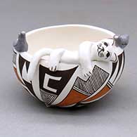 A polychrome bowl with a cat and two bird appliques perched on the rim, the bowl decorated with a geometric design
 by Judy Lewis of Acoma