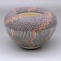 A polychrome Infinity pot decorated with a four-panel geometric design
 by Frederica Antonio of Acoma