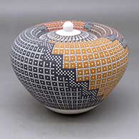 A lidded polychrome Infinity jar decorated with a four-panel geometric design
 by Frederica Antonio of Acoma