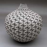 A black-on-white jar with a raised rim and a geometric design
 by Cletus Victorino of Acoma