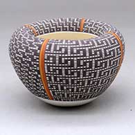 A small polychrome Infinity jar decorated with four-panels of fine line checkerboard geometric design
 by Frederica Antonio of Acoma