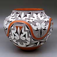 A polychrome jar decorated with a four-panel rainbow, fine line, kiva step and geometric design
 by Robert Patricio of Acoma