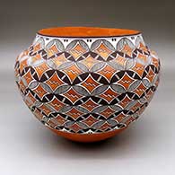 A polychrome jar decorated with a fine line and geometric design
 by Robert Patricio of Acoma