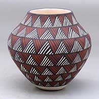 A polychrome jar decorated with an ancient rock art geometric design
 by Sandra Victorino of Acoma