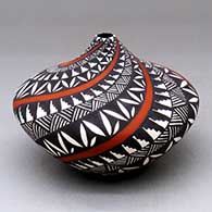 A polychrome tear-drop jar decorated with a spiraling fine line, kiva step and geometric design
 by Sandra Victorino of Acoma