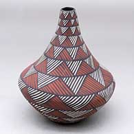 A polychrome tear-drop jar decorated with an ancient rock art geometric design
 by Sandra Victorino of Acoma