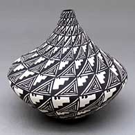 A black-on-white tear-drop jar decorated with a spiral mesa, kiva step and geometric design
 by Sandra Victorino of Acoma