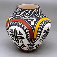 A polychrome jar decorated with a four-panel rainbow, flower, spiral, kiva step and geometric design
 by Sandra Victorino of Acoma