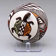 A polychrome seed pot decorated with appliques and a turtle and geometric design
 by Carolyn Concho of Acoma