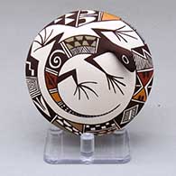 A polychrome seed pot decorated with appliques and a lizard and geometric design
 by Carolyn Concho of Acoma