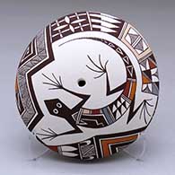 A polychrome seed pot decorated with a lizard and geometric design
 by Carolyn Concho of Acoma